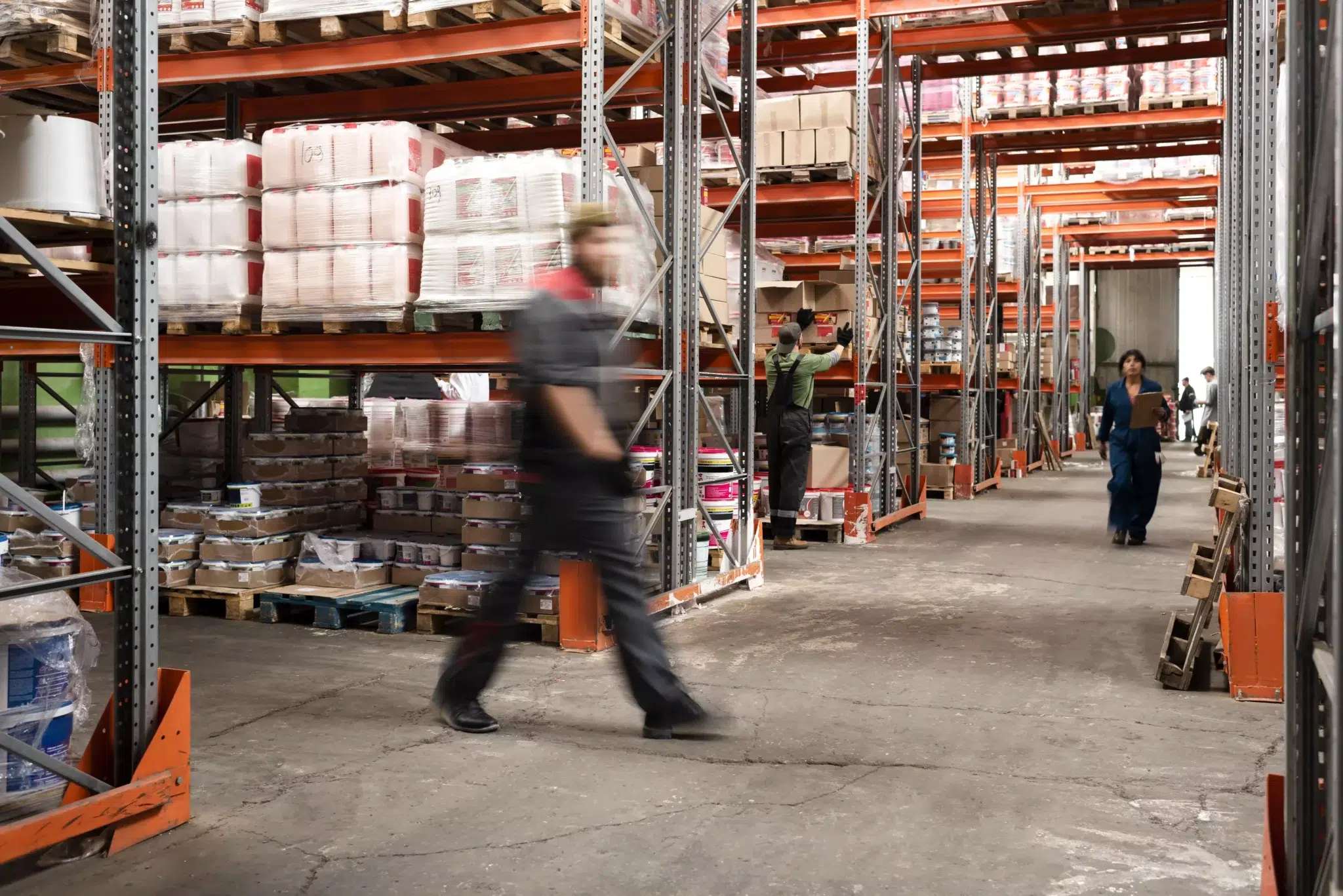 People walking through a warehouse