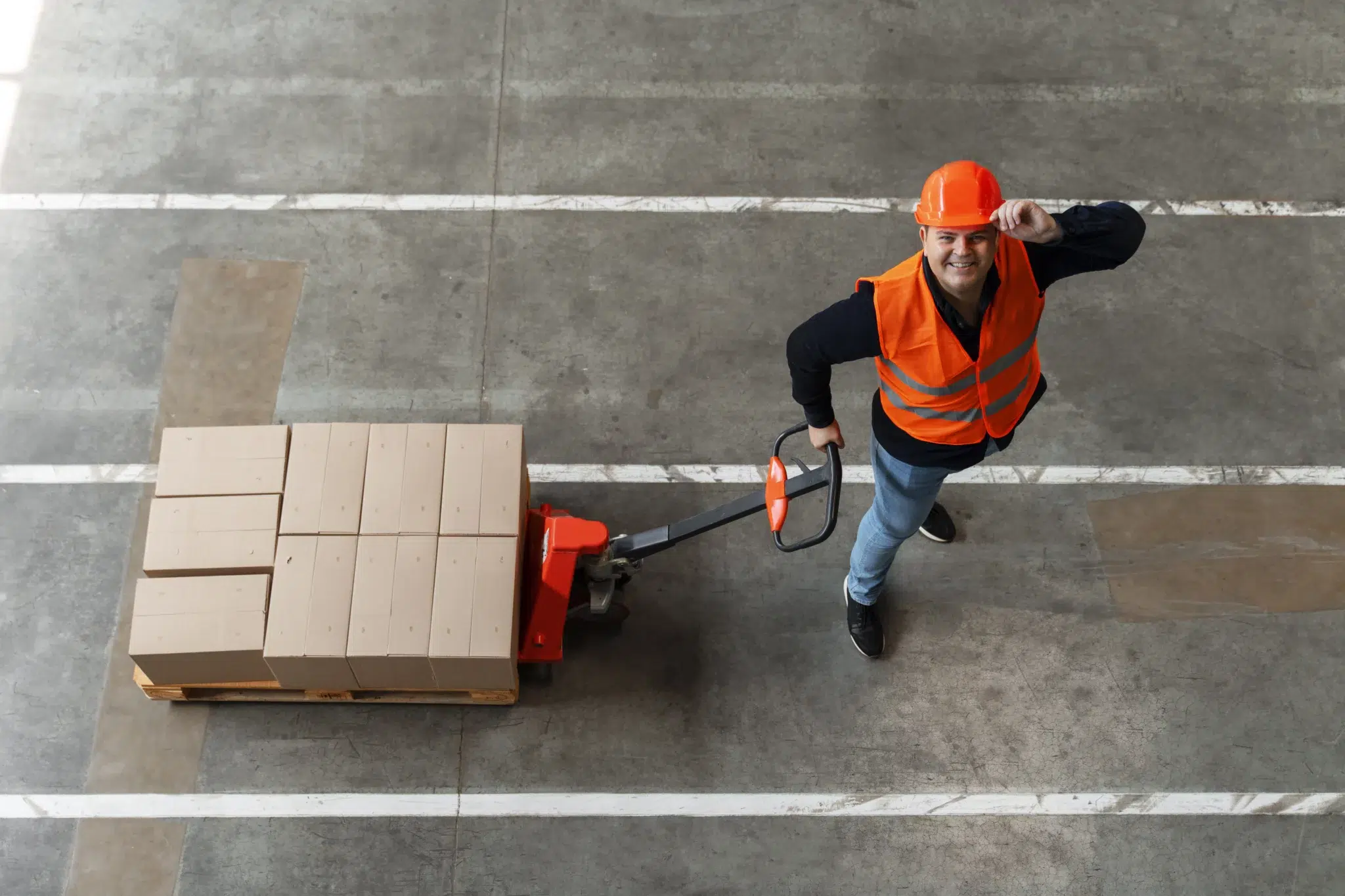 smiling man in a logistics warehouse
